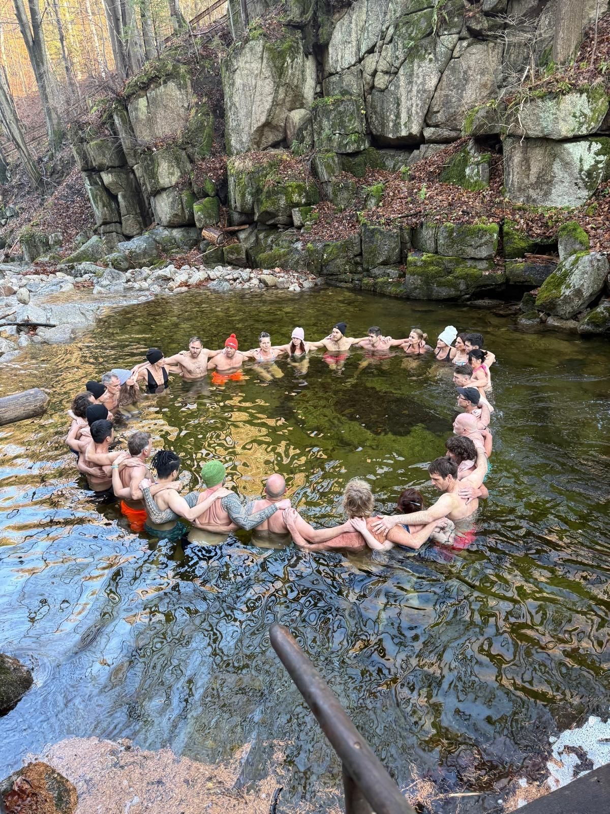 Participants together in a natural pool